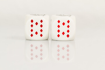 Two Tens Playing Casino poker dice closeup Isolated on white background with reflection. Abstract Pattern