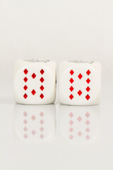 Two Tens Playing Casino poker dice closeup Isolated on white background with reflection. Abstract Pattern