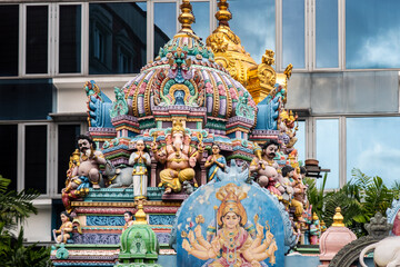 Sri Veeramakaliamman Temple dedicated to the Hindu goddess Kali, with richly decorated carved colorful roof with Hindu Gods and statues in Little India district in Singapore.