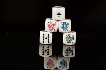 Straight Flush Playing Casino poker dice closeup Isolated on Black background. Abstract Pattern