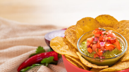 Mexican authentic homemade Guacamole with corn nachos chip traditional fresh healthy appetizer dip sauce for vegan