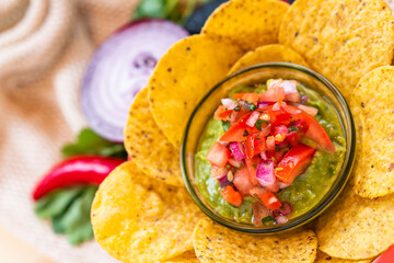 Mexican authentic homemade Guacamole with corn nachos chip traditional fresh healthy appetizer dip sauce for vegan