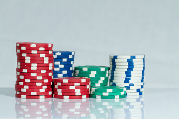 Red, Green, Blue, White and Black Playing Casino Poker Chips. Isolated on white background. Abstract Pattern