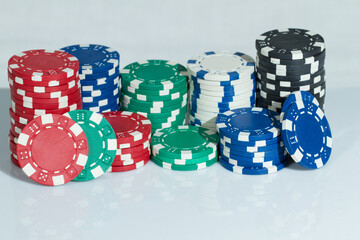 Red, Green, Blue, White and Black Playing Casino Poker Chips. Isolated on white background. Abstract Pattern
