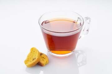 Black tea in a glass cup on a white background