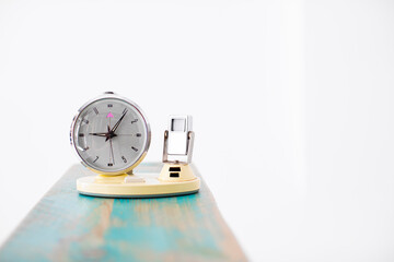 OLD YELLOW CLOCK WITH CALENDAR ON BLUE NATURAL WOOD