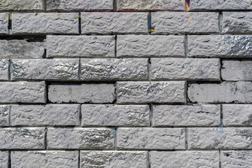 Fototapeta premium Gray stone wall with silver inserts