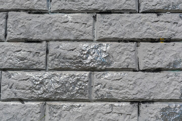 Gray stone wall with silver inserts 2