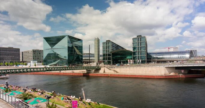 Berlin spree river waterfront and main station with ships and clouds moving