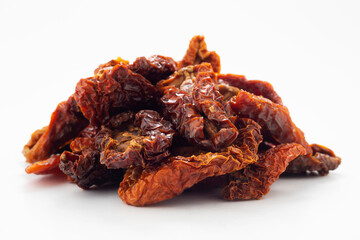 Dried tomatoes on white ground