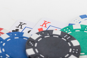 Pocket Kings, Hand Pair, Two Playing Cards and various color Poker Chips. Pattern Isolated on White Background.