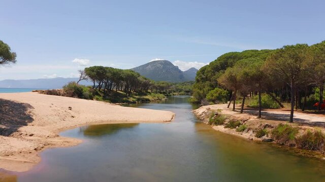 Drone forward video of Osala Beach. Colorful spring scene of Sardinia island, Italy, Europe. Beautiful seascape of Mediterranean sea. 4K video (Ultra High Definition).
