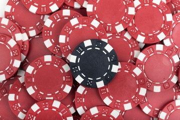 Battle Red versus Black yin vs yang Playing Poker Chips laying on the table mixed together. Abstract Pattern Background 