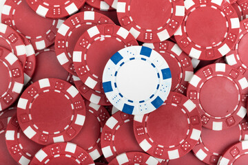 Battle White versus Red yin vs yang Playing Poker Chips laying on the table mixed together. Abstract Pattern Background 
