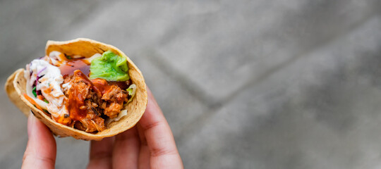 Mexican traditional authentic homemade tacos with pulled pork beef chili con carne serve with tomato salad and avocado guacamole and dip sauce