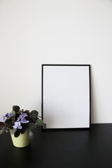 empty black frame mockup on table