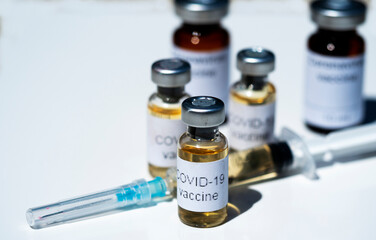 In this photo illustration, vials labelled as Coronavirus vaccine and a syringe seen displayed as the world anxiously awaits for the vaccine against coronavirus.