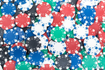 Playing Poker Chips laying on the table mixed together. Abstract Pattern Background