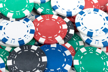 Playing Poker Chips laying on the table mixed together. Abstract Pattern Background