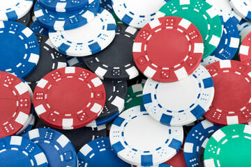 Playing Poker Chips laying on the table mixed together. Abstract Pattern Background