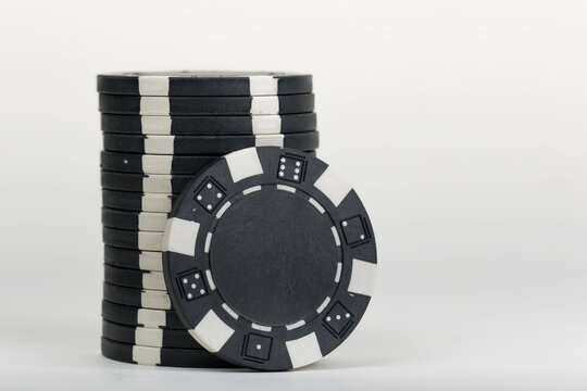 Black playing poker chip isolated on white background.