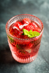 Old fashioned raspberry cocktail. Selective focus. Shallow depth of field.