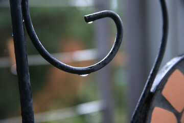 After the rain dew pipes on a steel pipe. Nida, Lithuania