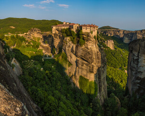 A beautiful monastery sits atop this rock formation in the heart of Meteora, Greece
