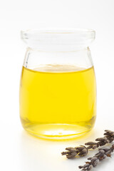 Olive oil in a bottle on a white background
