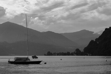 A sailing ship in Orta Lake, Piedmont, Italy. Clouds on the backgorund.