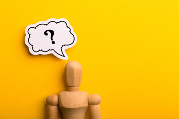 Wooden Man With Question Mark Speech Bubble