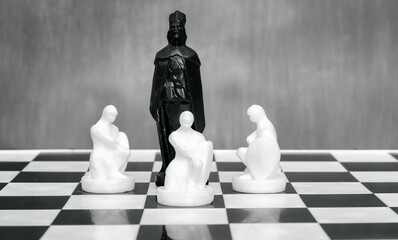 Black and white chess pieces on the chessboard. The concept of combating racism. Motivational...