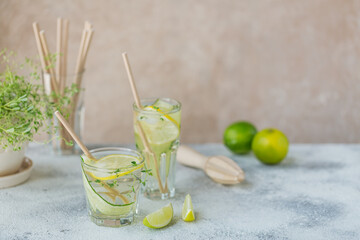 Glass of cucumber soda drink on wooden table. Summer healthy detox infused water, lemonade or cocktail background. Low alcohol, nonalcoholic drinks, vegetarian or healthy diet concept