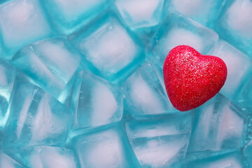red heart on ice cubes, frozen cold heart concept, symbol of love
- 366715474