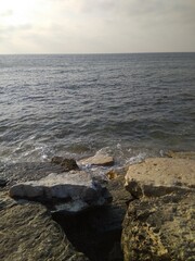 Beautiful views of the stones and the sea on the Mediterranean coast in summer.