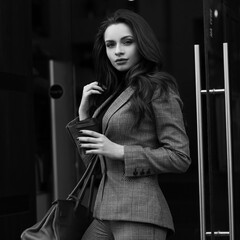 Stylish woman wearing gray suit
