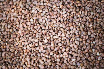 Buckwheat. Dry buckwheat background. The texture of buckwheat	