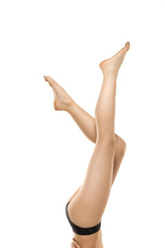 Light. Beautiful female legs, buttlocks isolated on white background. Beauty, cosmetics, spa, depilation, treatment and fitness concept. Sportive, sensual body with well-kept skin in underwear.