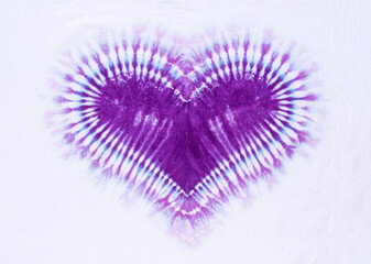 heart sign tie dye pattern on cotton fabric background.