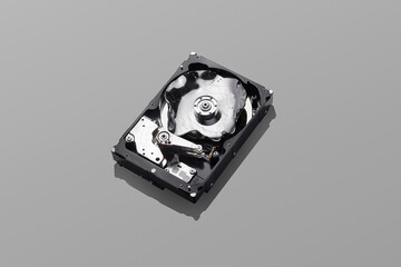 Broken hard disks pattern on isolated grey background