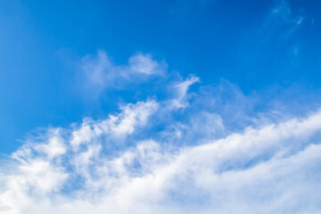 Naklejka na ściany i meble Blue sky background with tiny clouds. Blue sky background with clouds.