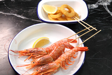 Beer pub. Seafood snack for beer. Langoustines, beer, squid rings.
