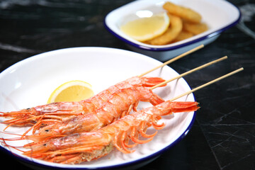 Beer pub. Seafood snack for beer. Langoustines, beer, squid rings.
