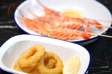 Beer pub. Seafood snack for beer. Langoustines, beer, squid rings.
