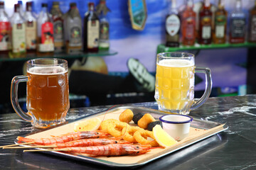 Beer pub. Langoustines and beer. Beer and seafood snacks. Langoustines, beer, squid rings. 