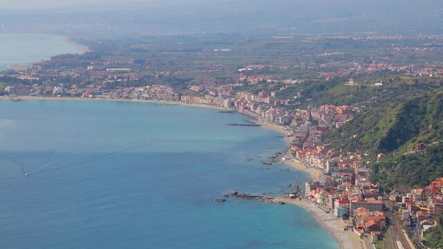 Bright morning cityscape of Giarre town. Nice spring seascape of Mediterranean sea. Aerial view of Sicily, Itale, Europe. Traveling concept background. Full HD video (High Definition).