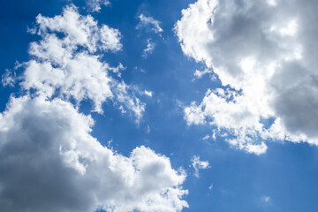 White and grey clouds on a blue sky