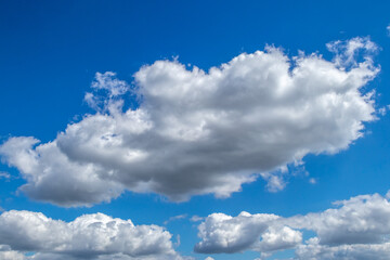 White and grey clouds on a blue sky