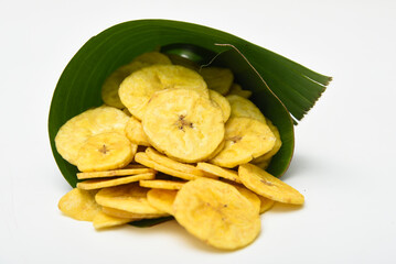Kerala banana chips  popular deep fried snack traditional South Indian tea time snack on banana leaf, Kerala India. made in coconut oil on Onam, Vishu, Diwali/Deepawali, Ramzan, Eid. 