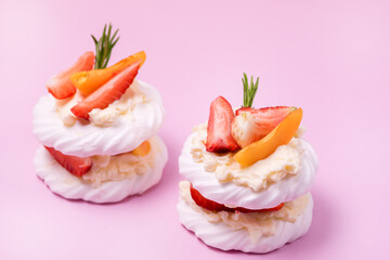 Homemade Pavlova Meringue Cake Decorated with Fresh Berries and Fruits and Whipped Cream Dessert Horizontal Above